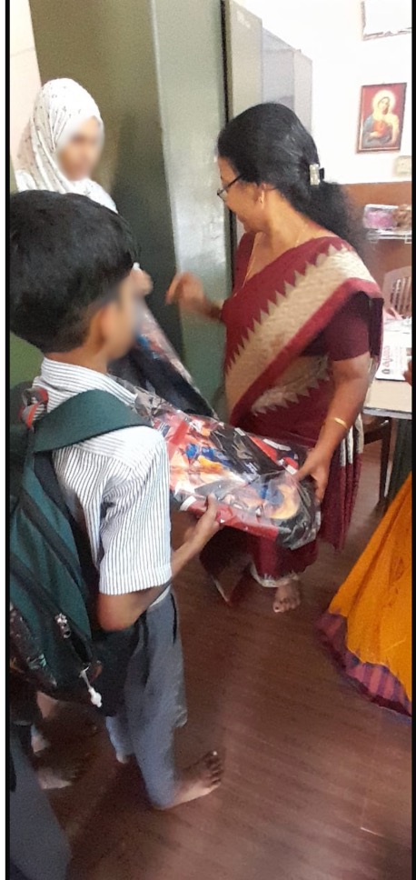 Boy receiving school supplies package