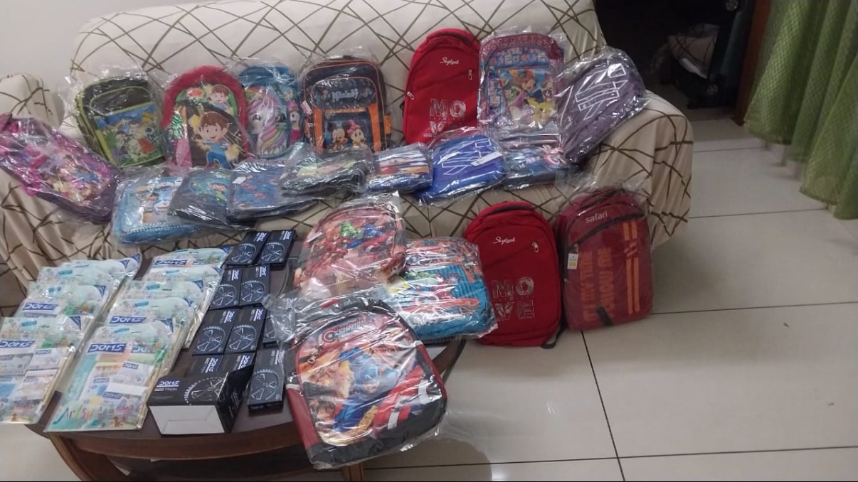 Collection of backpacks and supplies ready for distribution